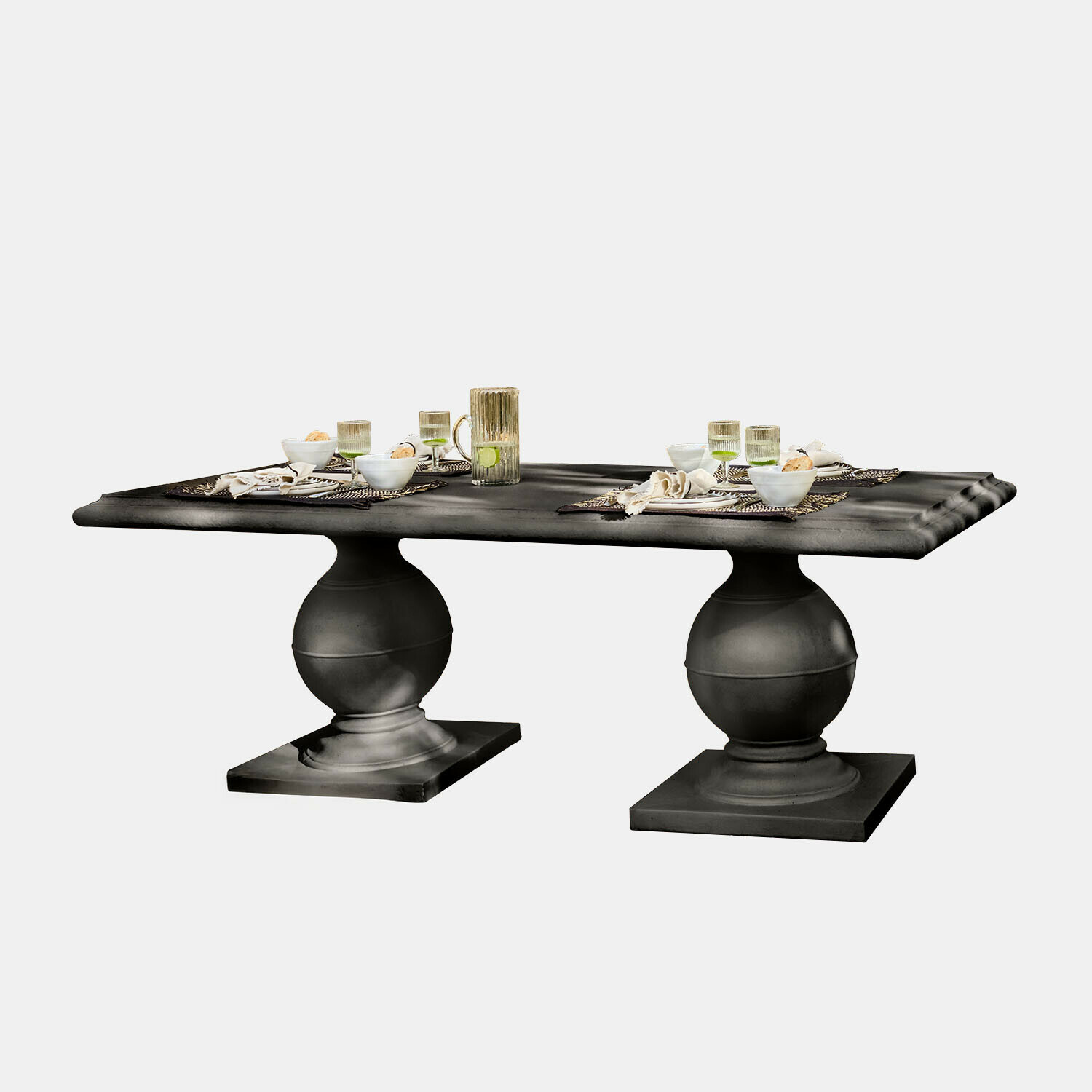 Tafel Talvero Zwarte eettafel met twee bolvormige poten en rechthoekig blad met gedekte tafel