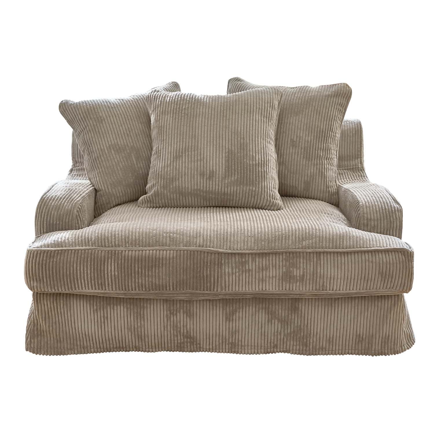 Beige corduroy bank met drie kussens, comfortabel voor woonkamer