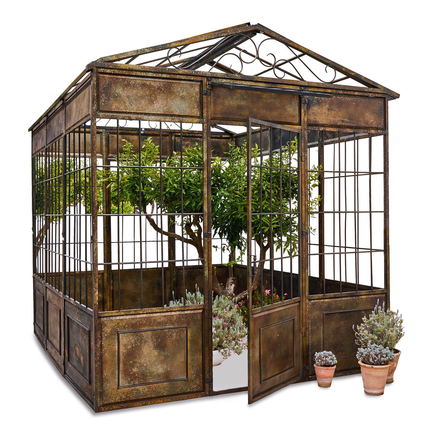 Paviljoen Essone Verweerde metalen orangerie met open deur en planten binnenin voor tuin