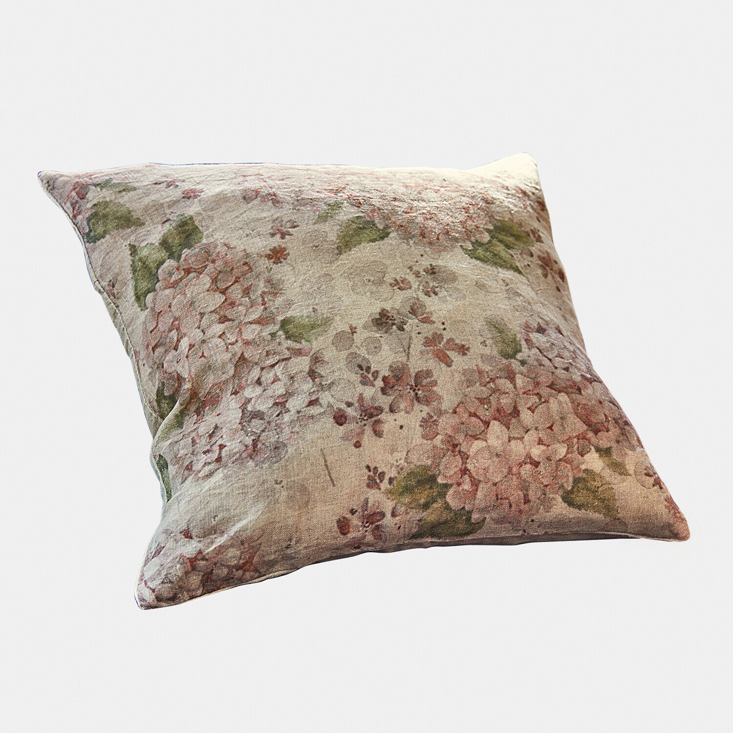 Decoratief linnen kussen met bloemenpatroon in roze en groene tinten, zacht en stijlvol