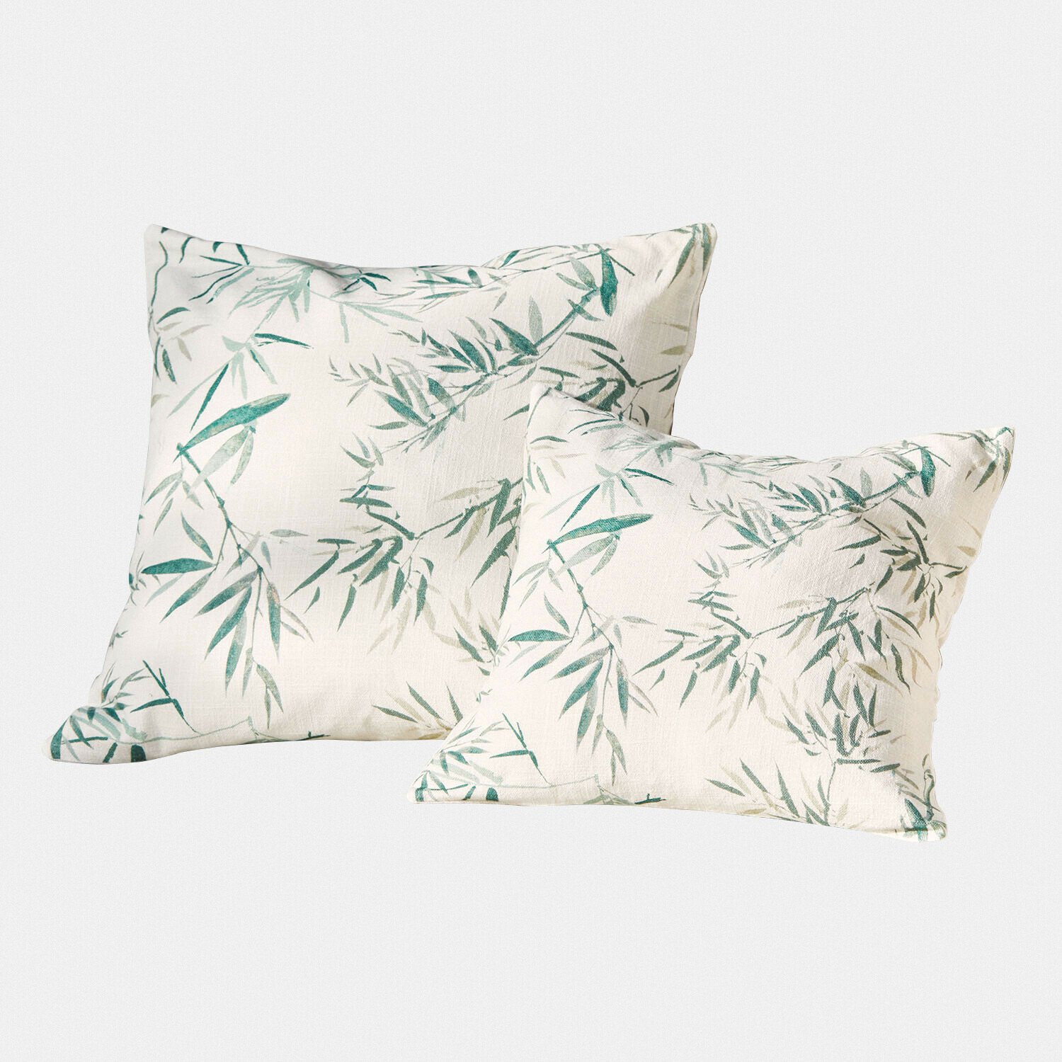 Set van twee decoratieve katoenen kussens in crème met groen bamboebladmotief