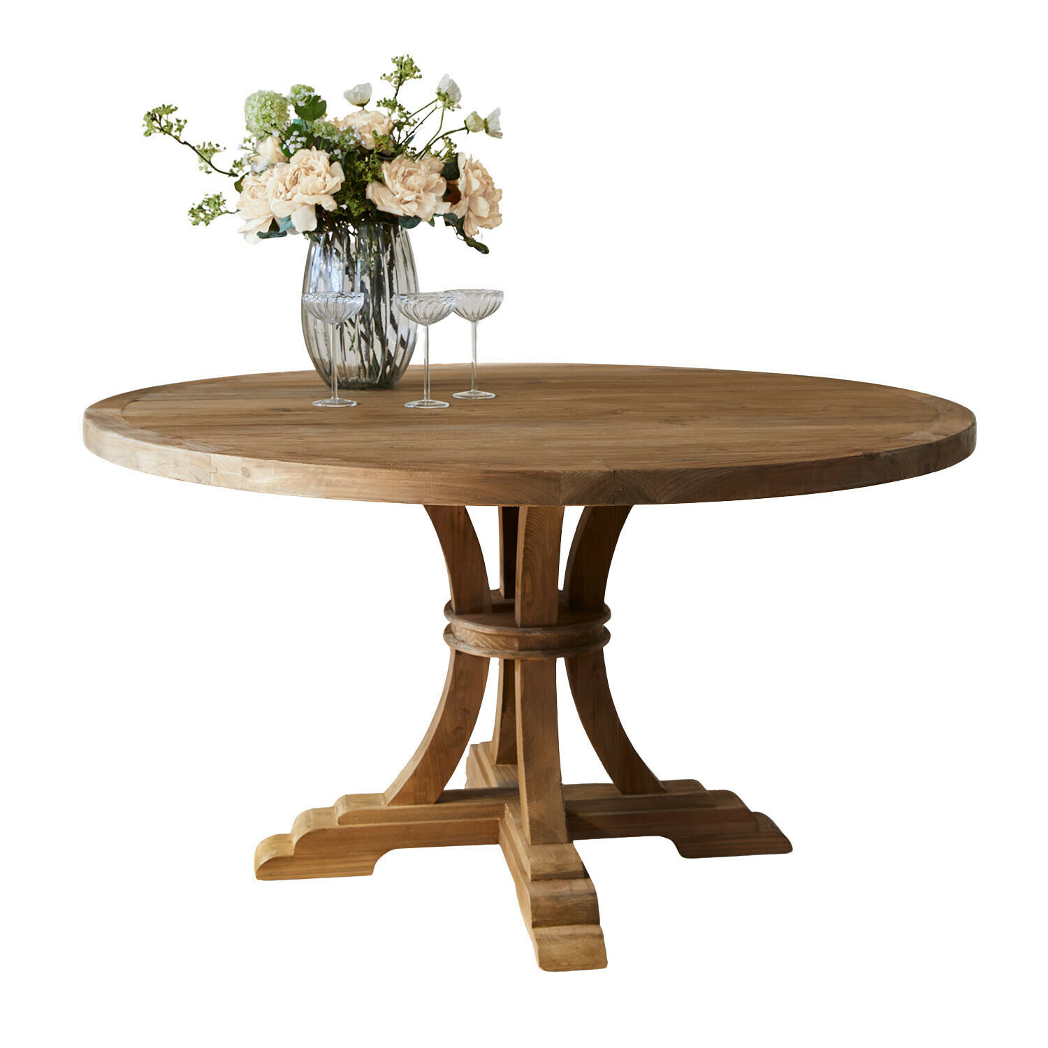 Ronde houten tafel in natuurlijke kleur met vaas en bloemen op het blad, eetkamermeubel