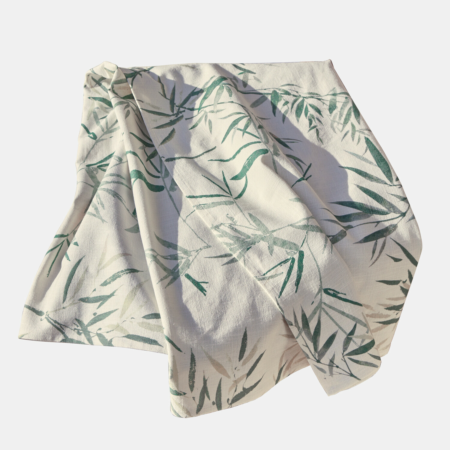 Witte linnen tafelkleed met groen bladmotief, decoratieve natuurlijke stof voor thuis