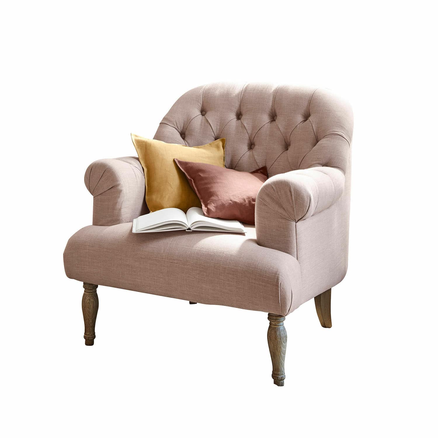 Fauteuil Shambrook Roze gestoffeerde bank met houten poten, versierd met twee kussens en een open boek