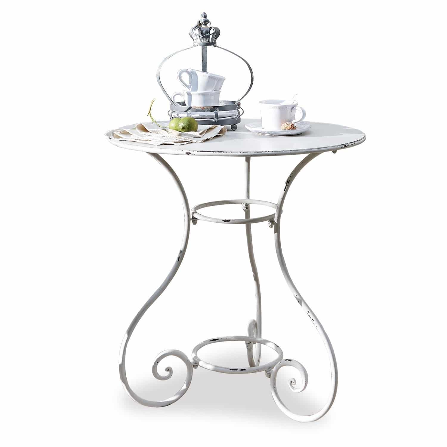 Tafel Iteuil Ronde witte metalen tafel met sierlijke poten en koffiekopjes op het blad