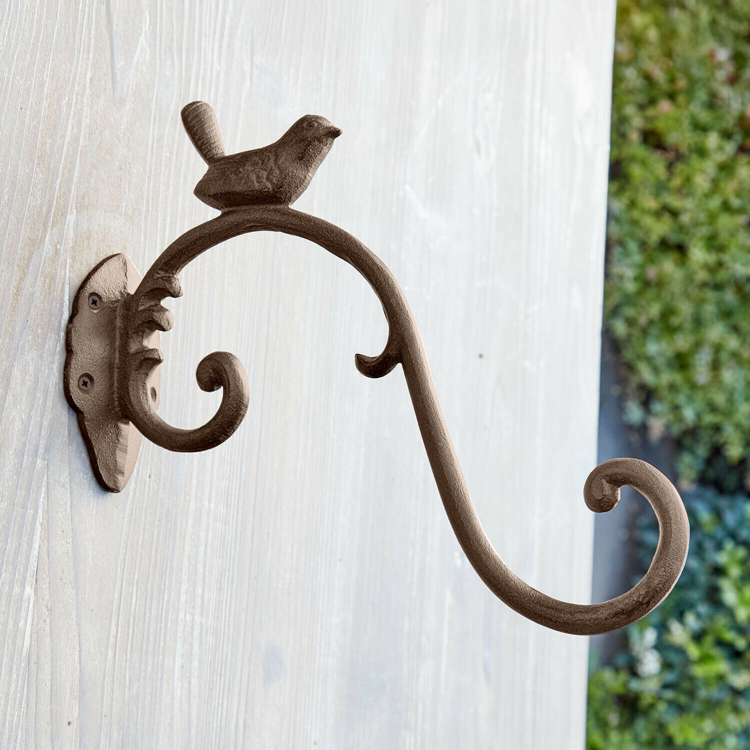 Wandhaak Grelonne Bruine metalen wandhaak met decoratieve vogel en gebogen arm om spullen aan te hangen