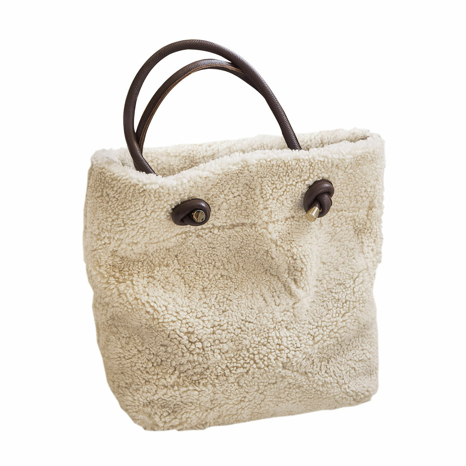 Tas Tarvin Beige tas van zacht teddy-materiaal met bruine leren handvatten, modieuze dagelijkse accessoire