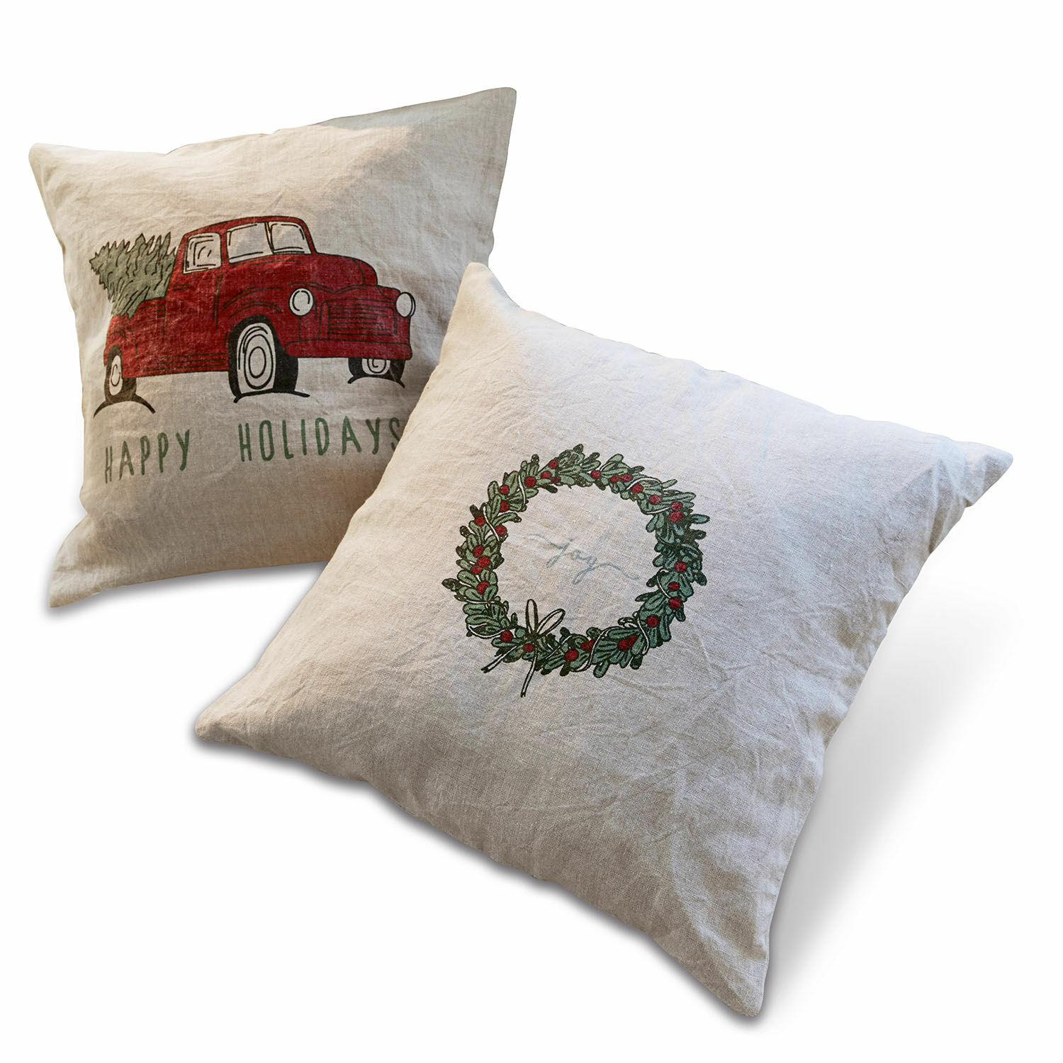Linnen kussens met kerstmotieven, rode auto en groene krans, feestelijke decoratie