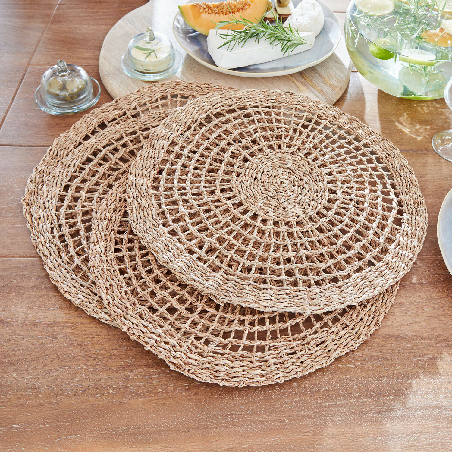 Placemat set van 4 Sauvrelle Set van drie ronde placemats van natuurlijk gevlochten beige materiaal voor op tafel