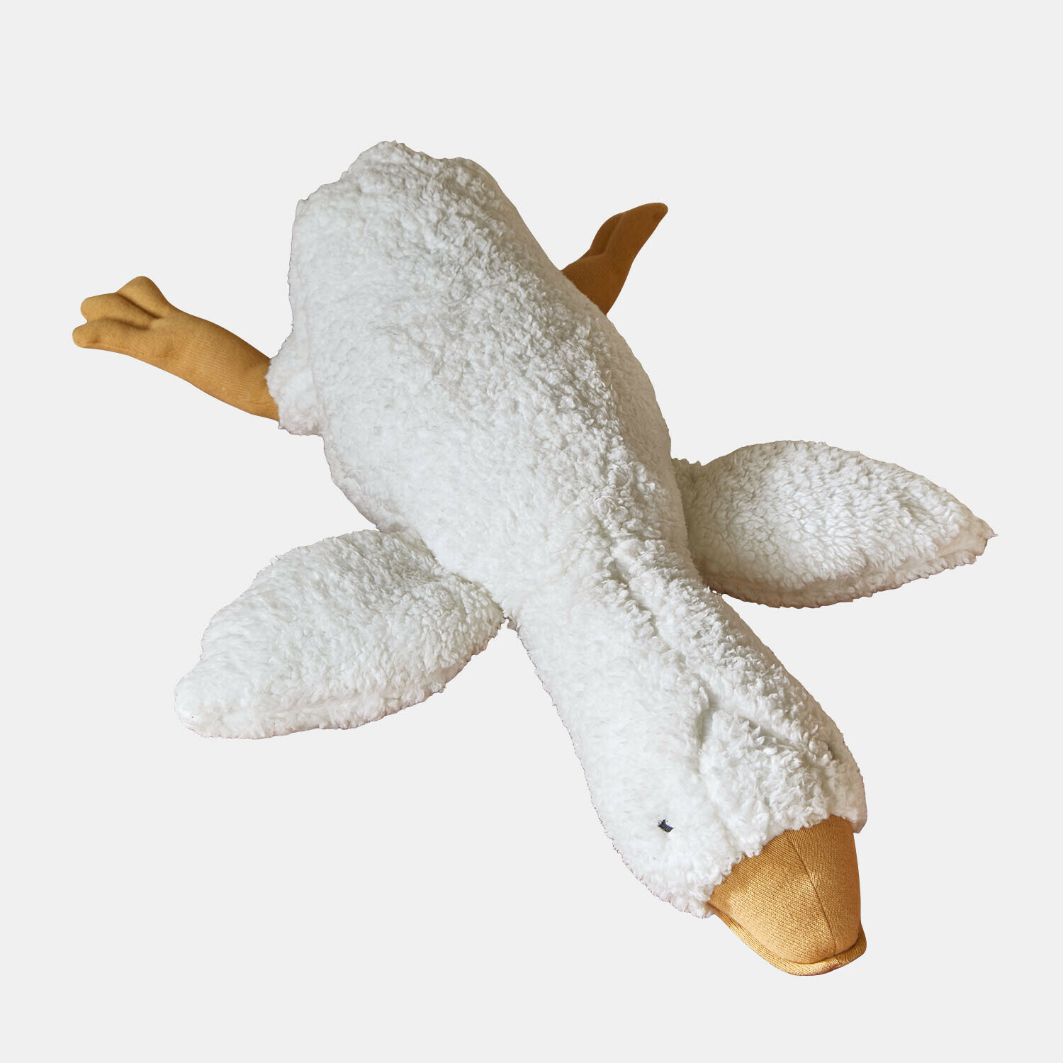 Zachte knuffelgans met witte vacht en oranje snavel en poten, knuffelbaar en zacht