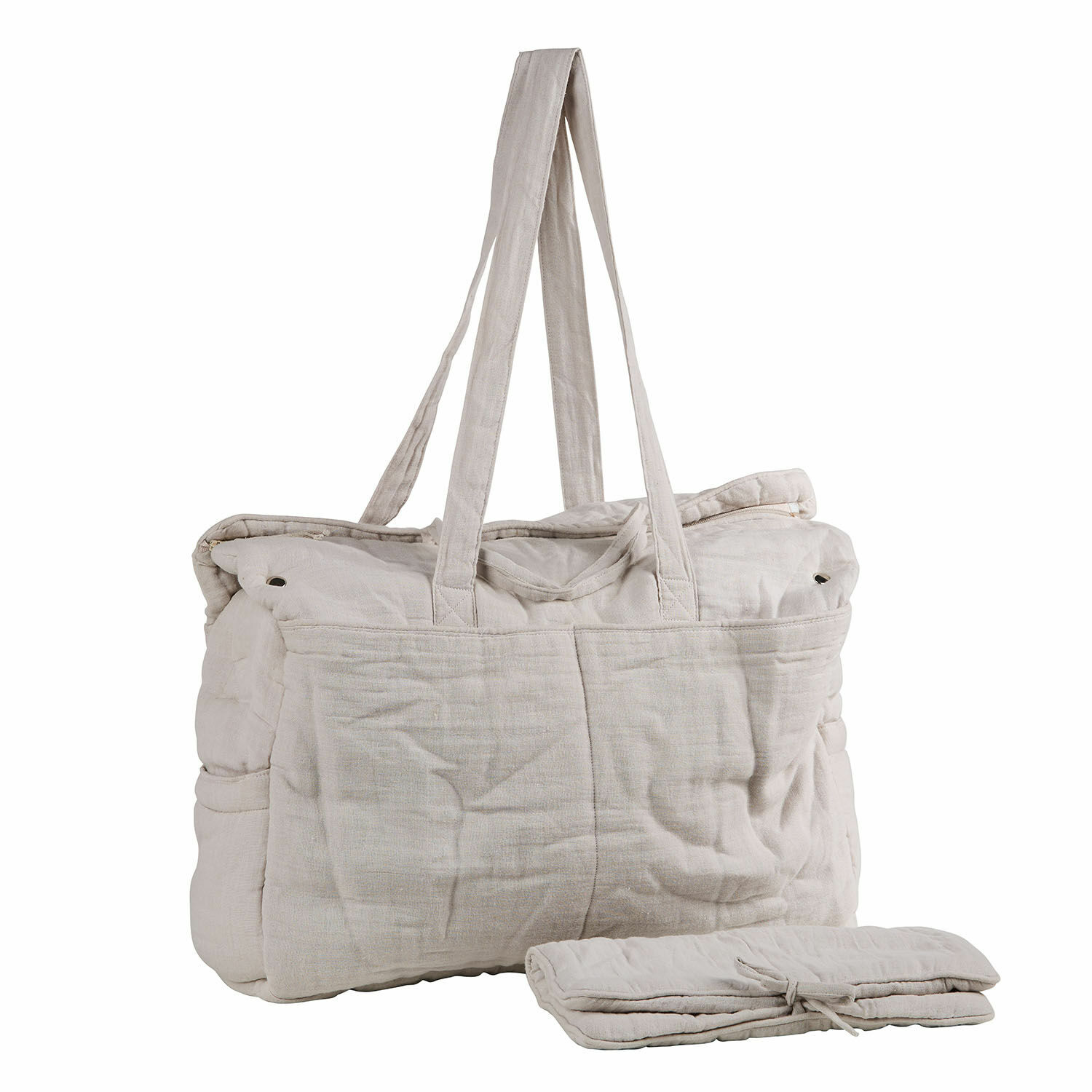 Luiertas Mireval Beige stoffen tas met lange hengsels en opgevouwen element ernaast, praktische reistas