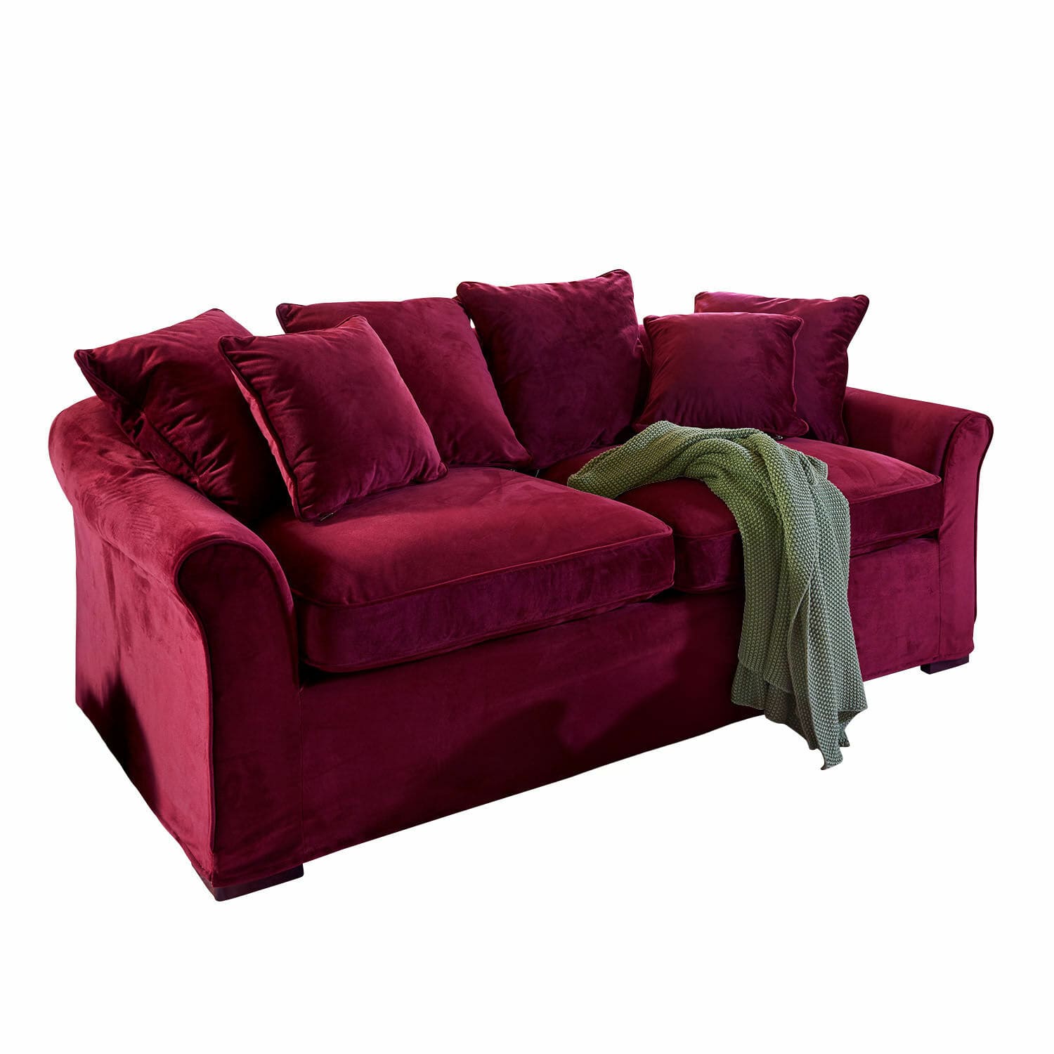 Bordeauxrode fluwelen bank met kussens en groene gebreide deken, comfortabele woonkamermeubel