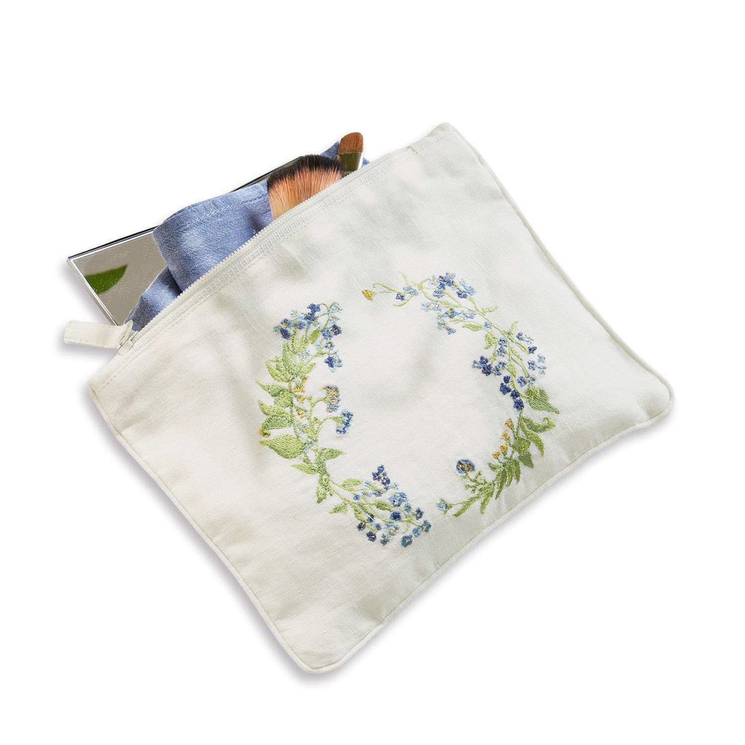 Witte linnen make-uptas met bloemenborduursel, kwasten en spiegel binnenin