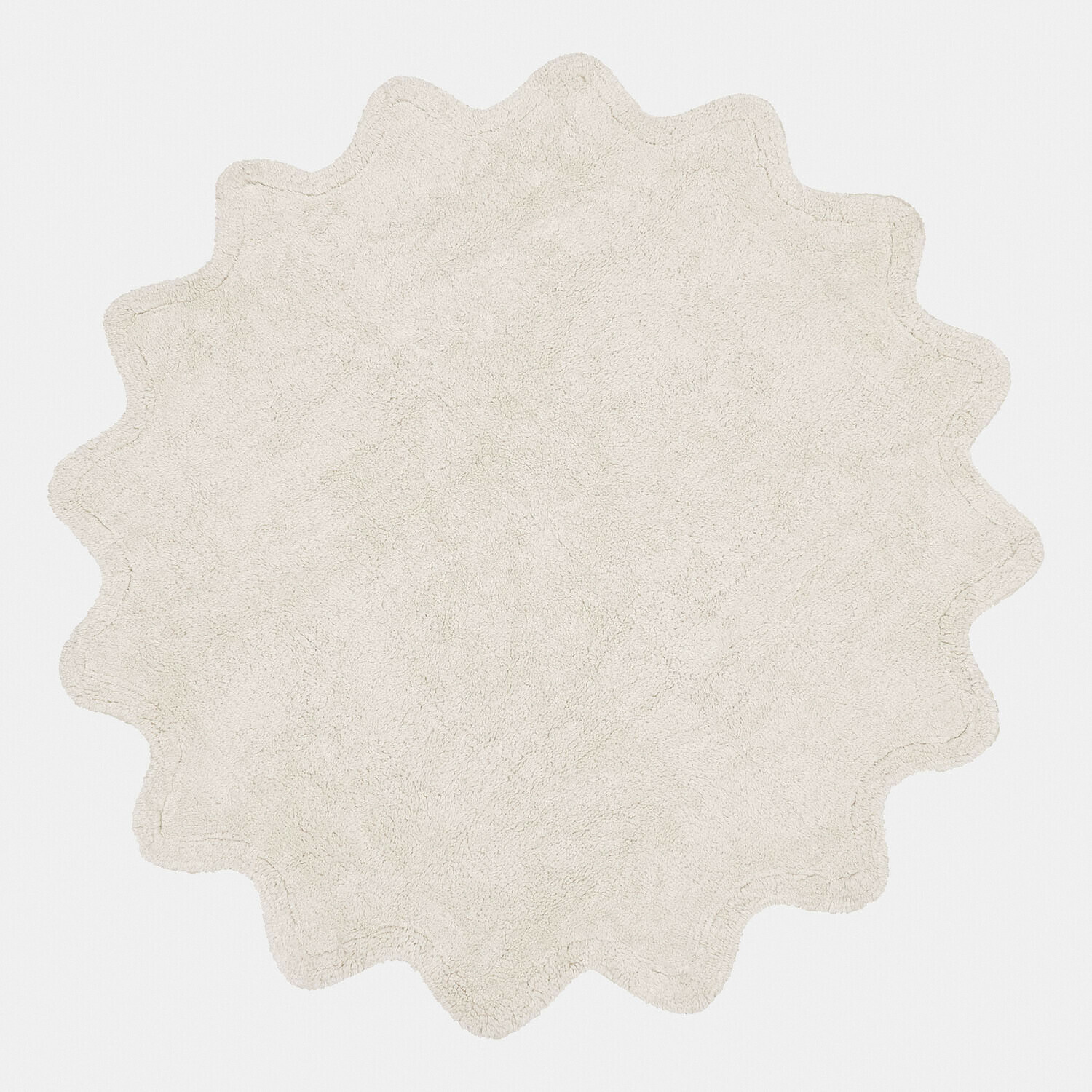 Ronde crèmekleurige badmat van zacht materiaal met golvende rand voor stijlvolle inrichting