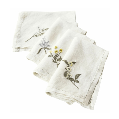 Witte linnen servetten met geborduurde bloemen, decoratief en elegant voor op tafel