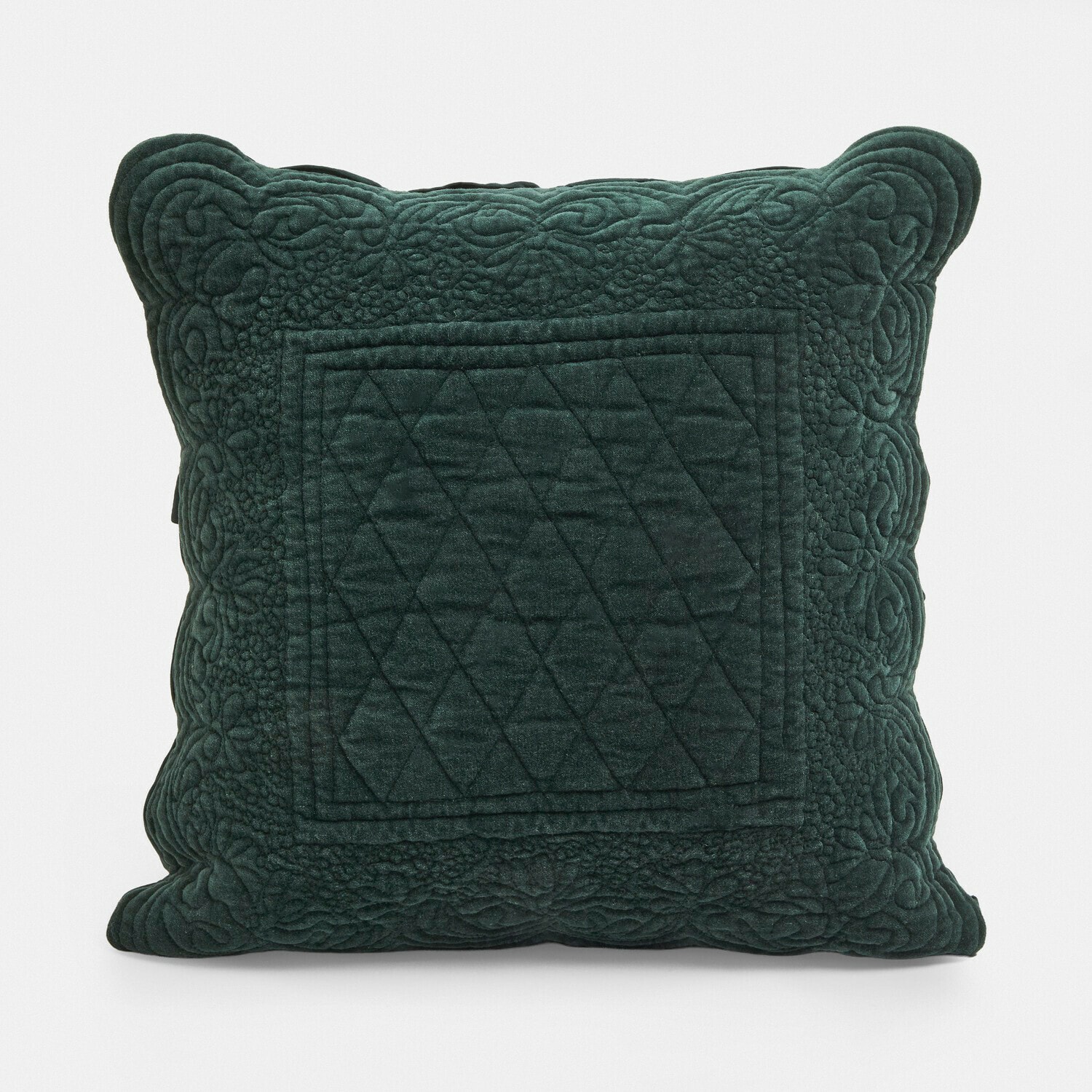 Groen fluwelen kussen met doorgestikt patroon en decoratieve rand, woonaccessoire