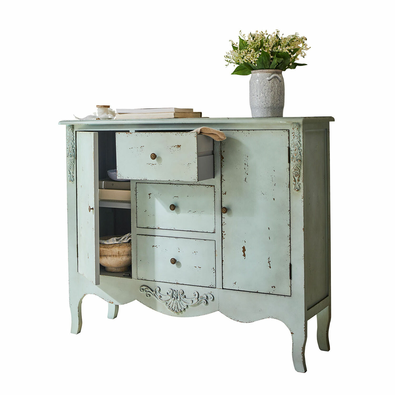 Mintgroene vintage houten dressoir met lades en decoratieve details voor woonkameropslag