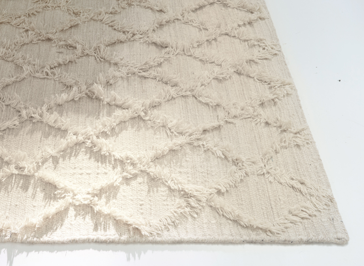 Beige vloerkleed met zacht ruitpatroon en franjes, boho interieurdecoratie